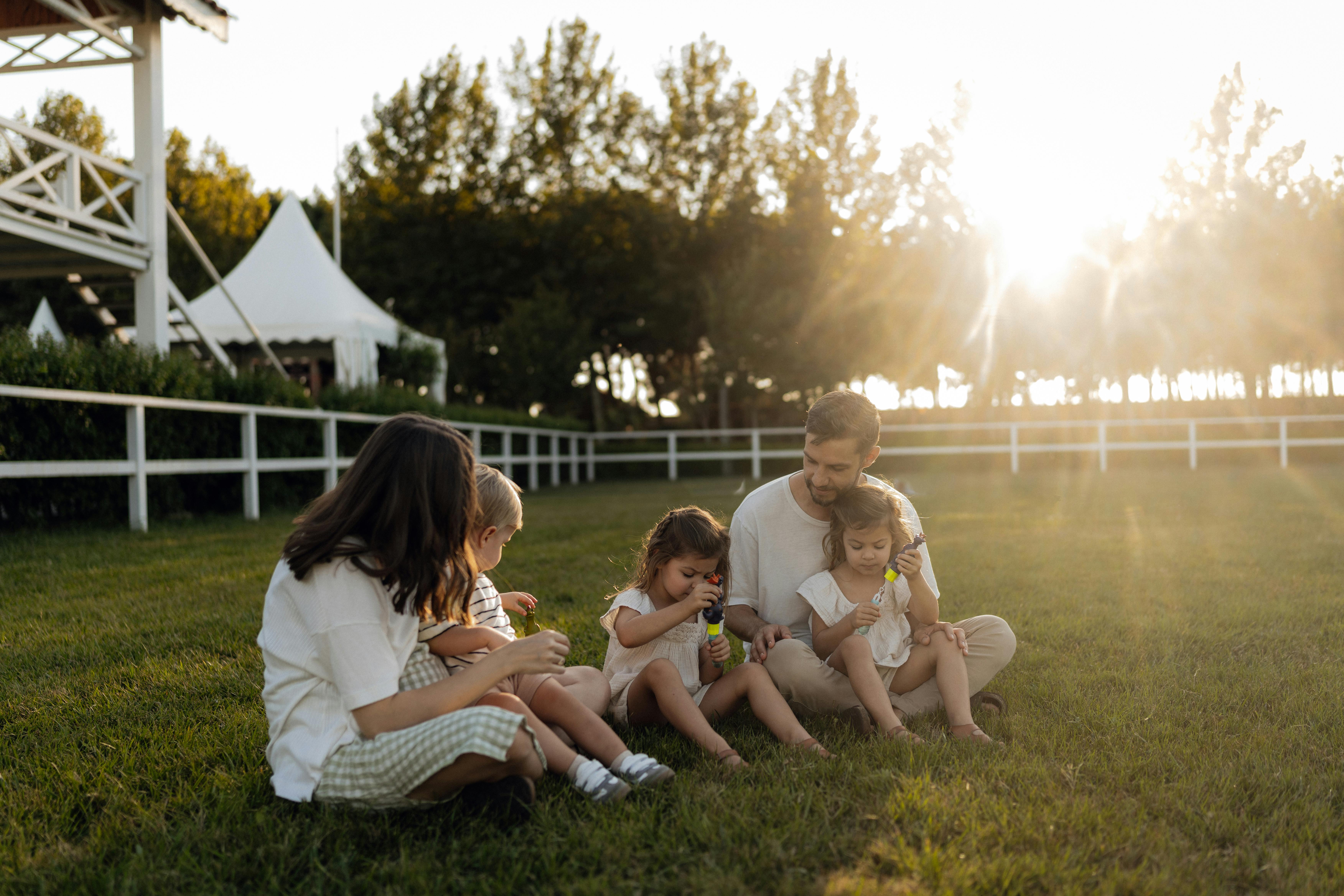 A family playing together, smiling and at ease