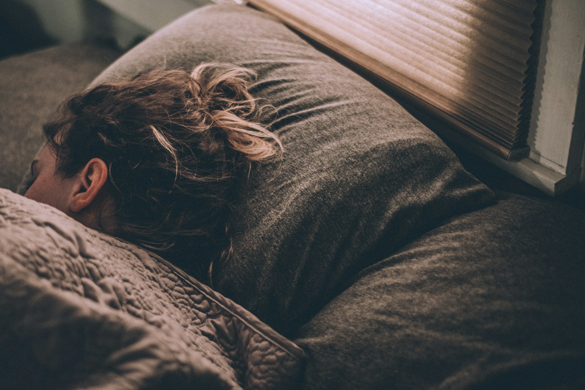A woman sleeping peacefully in bed